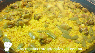 Paella Valenciana con pollo conejo y costillas